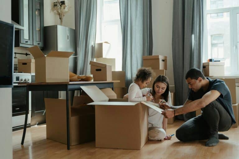 A young family is packing for their move to Hackney.