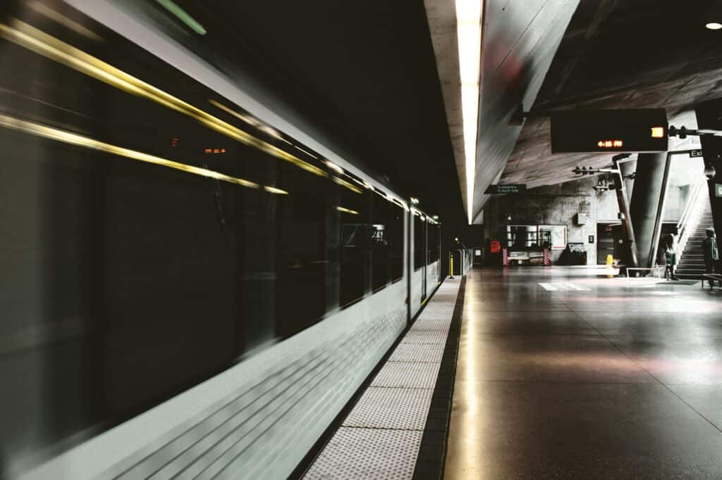 Empty platform with a train leaving the station