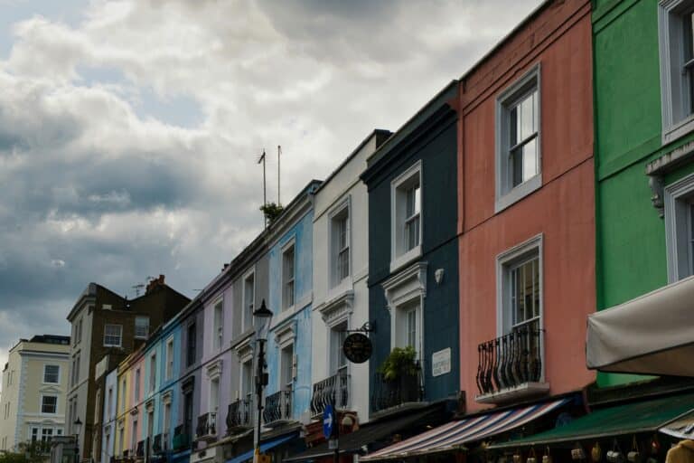 A row of colourful apartment in the concept of 'best affordable housing options in Hackney'.