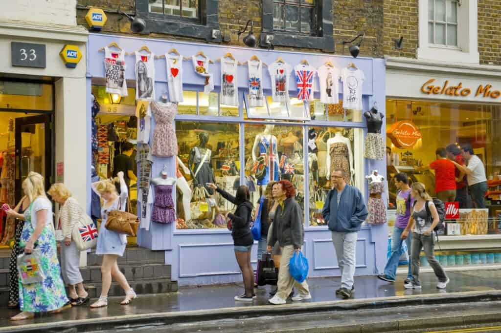 People walking along the independent shops in the concept of 'best local shops and markets in Hackney'.