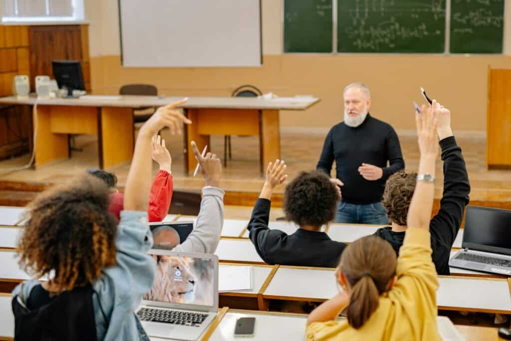 A professor with actively participating students inside the classroom